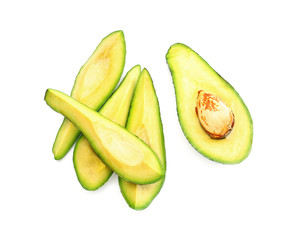 Pieces of ripe avocado on white background