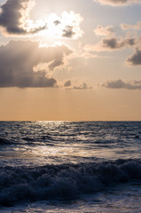 Fototapeta premium Amazing sea sunset, the sun, waves, clouds