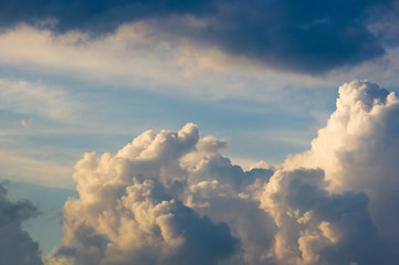 Landscape with dramatic light - beautiful golden sunset with saturated sky and clouds.