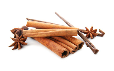 Cinnamon sticks, vanilla pods and anise stars on white background