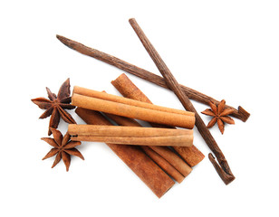 Cinnamon sticks, vanilla pods and anise stars on white background