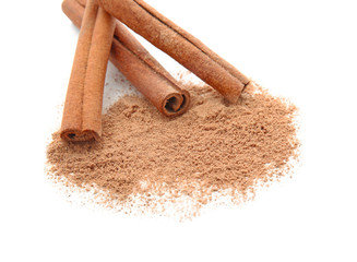 Cinnamon sticks and powder on white background