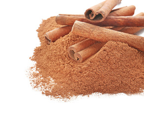 Cinnamon sticks and powder on white background