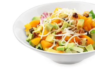 Plate of tasty salad with ripe avocado on white background, closeup