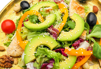 Plate of tasty salad with ripe avocado, closeup