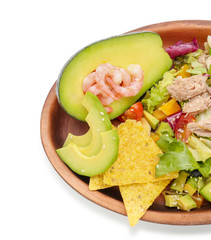 Plate of tasty salad with ripe avocado on white background