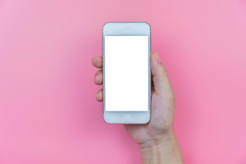 Handle phone on the pink pastel color background.