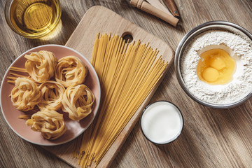 preparation recipe bread, pizza, spaghetti making ingridients, food flat lay on kitchen table...