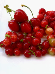 red fruits berries in a white tray