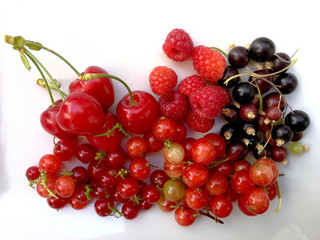 red fruits berries in a white tray