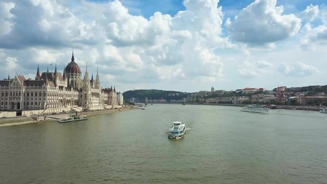 Budapest, Hungary - Sightseeing boat on River Danube with Parliament of Hungary on a sunny day