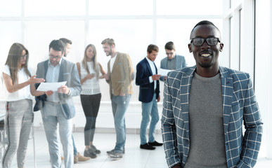 businessman standing in the hall of the modern office