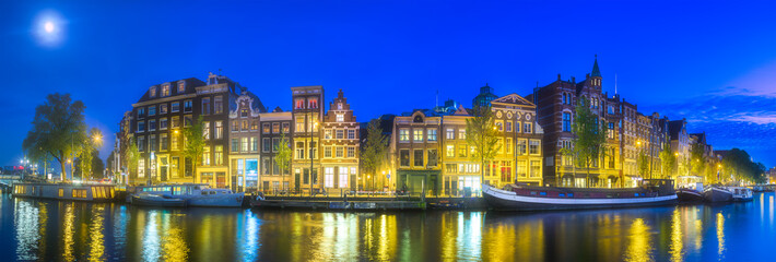 Amsterdam city skyline with moon, Netherlands