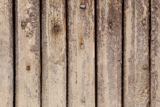 Aged wooden plank textured background, brown paint shabby and firty surface pattern. Macro view