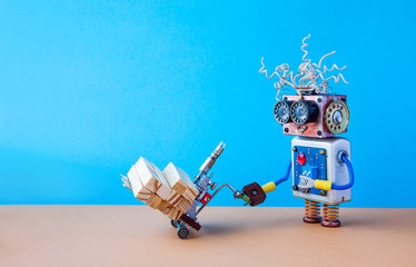 Robot moving powered pallet jack with wooden blocks. Forklift cart mechanism on blue wall, brown floor background. Copy space. Robotic automation delivery service transportation logistic concept