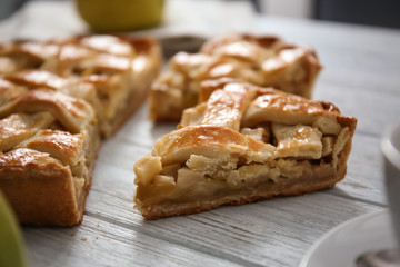 Tasty homemade apple pie on wooden table