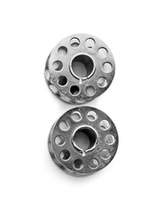 Metal spools for thread on white background
