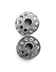Metal spools for thread on white background