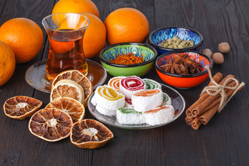 Lokum with tea and traditional sweets on table