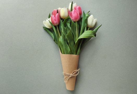 Bouquet of beautiful tulips on grey background