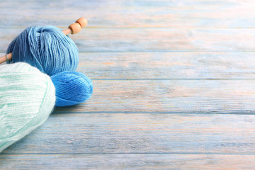 Color knitting yarn on wooden table