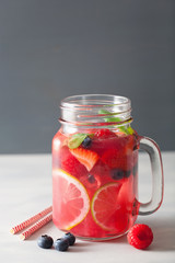 summer berry lemonade with lime and mint in mason jar