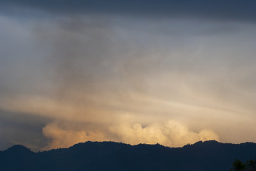 Cumulonimbus in dramatic sunset and mountain silhouette in central america, Guatemala.