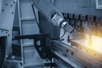 The robot for metal handing sheet metal in forming process .Modern factory for industrial 4.0 manufacturing process.