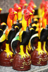 group of Decorative colorful ceramic chicken figurine, handmade souvenir in Asia for home decoration, advertisement