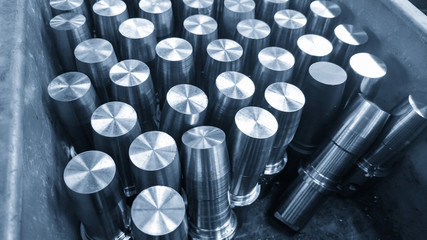 The stack of metal rod after turning process in the light blue scene.Material for manufacturing...