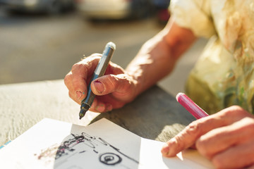 Close up man working of Architect sketching a construction project on his plane project at site construction work