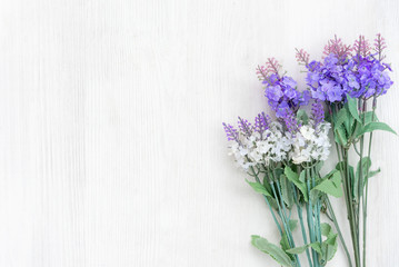 Fresh lavender flowers of spring time and sunny day on white wood table background.  Lifestyle Concept