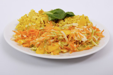 Baked Bulgar with cauliflower and vegetable salad on a white