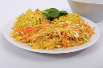 Baked Bulgar with cauliflower and vegetable salad on a white
