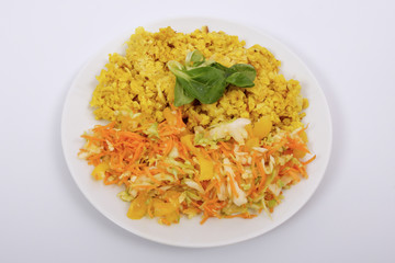 Baked Bulgar with cauliflower and vegetable salad on a white