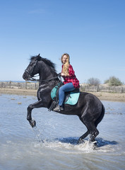 riding woman on the beach