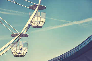 Vintage stylized picture of two Ferris wheel cars.