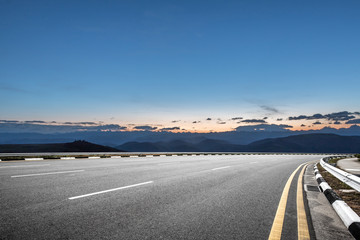 empty asphalt road with sunrsise