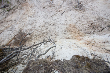Open pit quarry ore white kaoline mining with blue sky and water