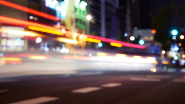 Time lapse Footage of Night city street lights and Defocused car lights