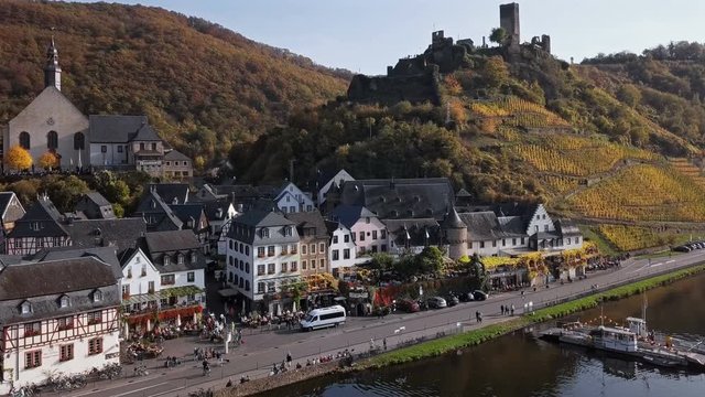 Flight over Beilstein town and autumn vineyards, Mosel valley, Germany.