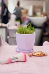Modern make-up tools lying on table in beauty salon