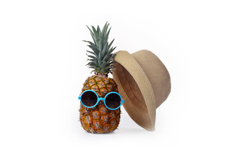 A pineapple in a dark mirror on a white background