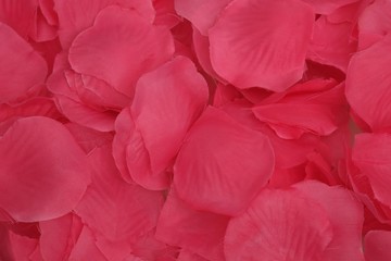 Obraz premium Background of artificial pink petals for the design of posters, banners and advertising