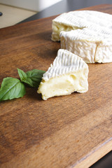 Camembert brie cheese on a wooden background