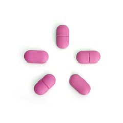 Coloured pills isolated on white background