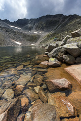 Amazing panorama of Ledenoto (Ice) Lake and clouds over Musala Peak, Rila mountain, Bulgaria