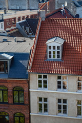 aerial view of various buildings and rooftops in copenhagen, denmark