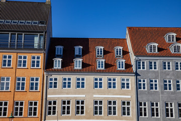 beautiful historical houses against blue sky in copenhagen, denmark