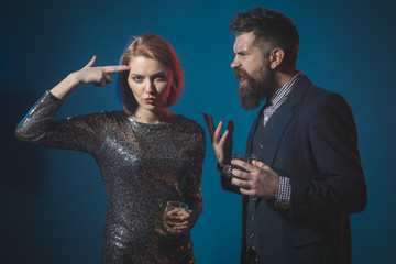 Office party and alcohol related accidents. Man in suit and lady at corporate party drinking. Celebration with alcohol concept. Man with beard and woman in dress office workers celebrating holiday